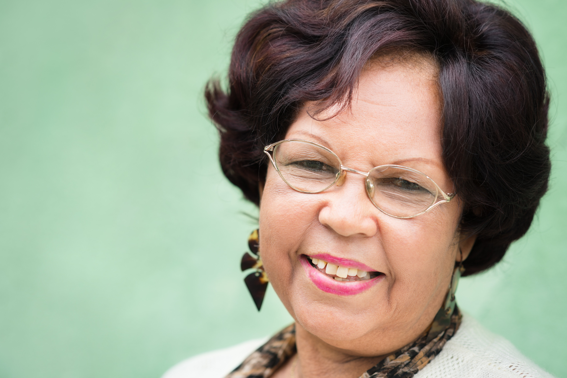 Portrait of happy elderly black lady with eyeglasses smiling group coaching 5